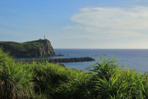 沖縄の漁港と夕日（イメージ）